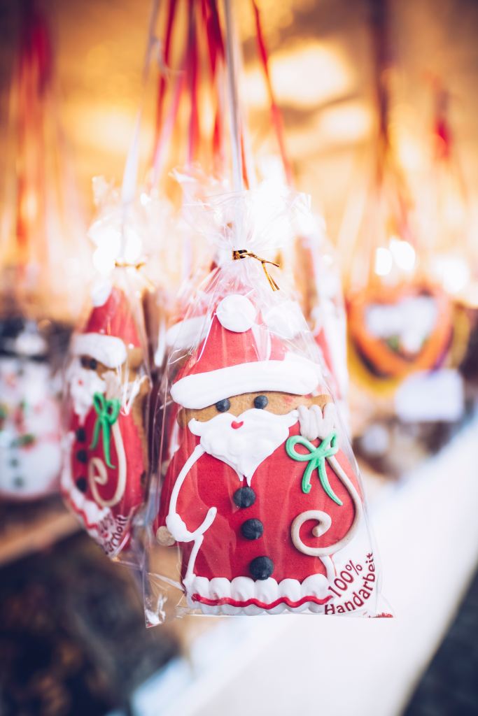 Sugar cookies in a bag that look like Santa Claus. 