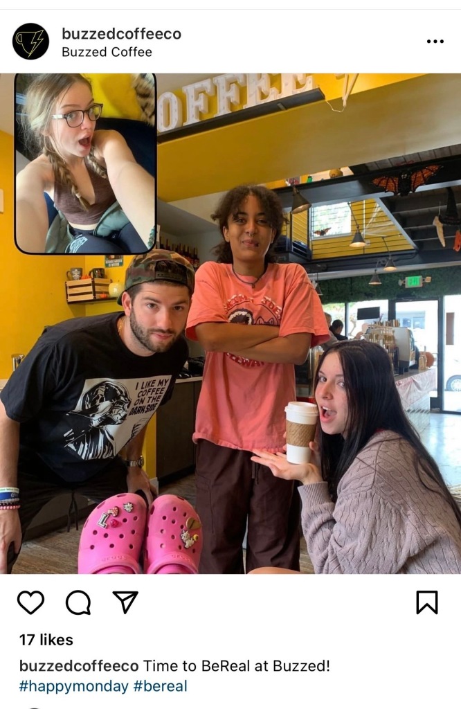 Screenshot of a BeReal at Buzzed Coffee in Reno with folks holding coffee cups.
